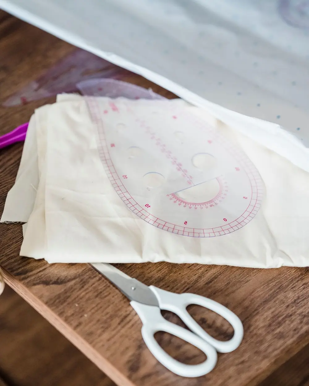Cotton fabric, scissors and sewing tools in a studio; stock photograph, not the retreat garment